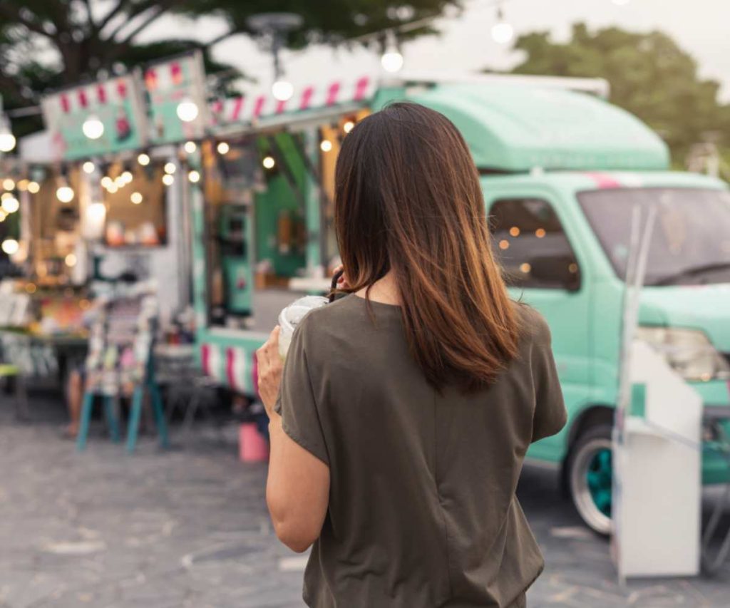 Customer being served at a food truck window