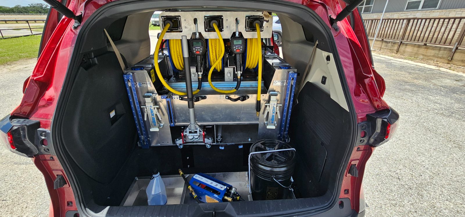 Sienna mobile service build with dual electronic oiling stations, rear hatch open